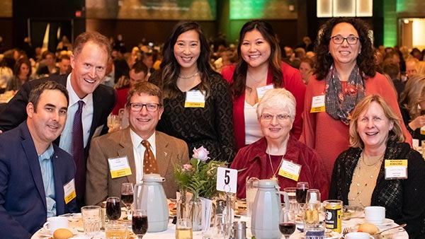 Tourtellott poses with members of the College's administration during the annual Duluth Area Chamber of Commerce dinner.