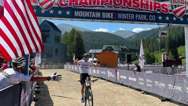 John Wessley crossing the finish line at the National Championships.