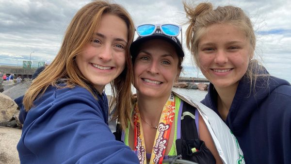 Rognerud and her daughters Madi (left) and Cali (right) at the finish line of Grandma's Marathon in 2021.