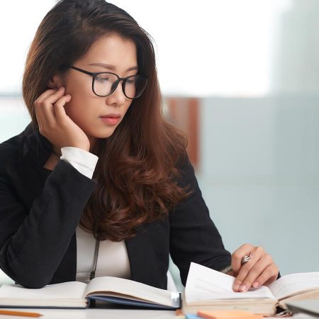 Person review materials in a lawyers office.