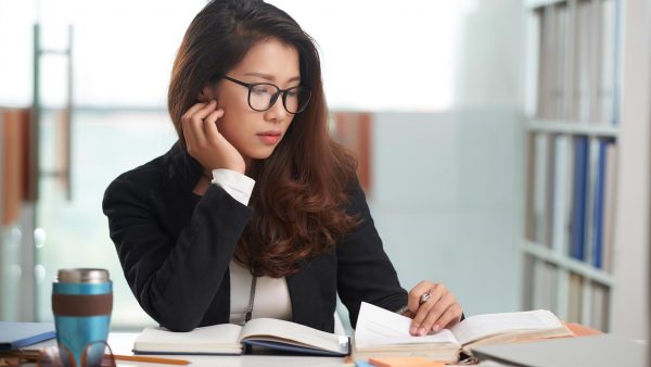 Person review materials in a lawyers office.