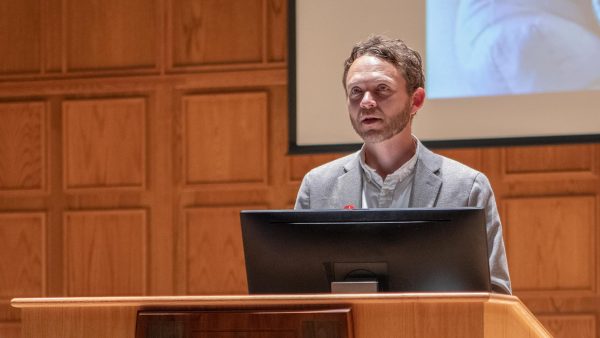 Tim Lorek presenting at an Alworth for Peace and Justice lecture.