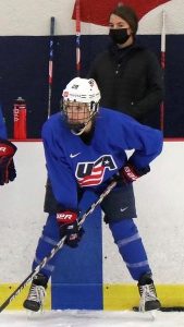 Megan Hautajarvi observes a hockey game.