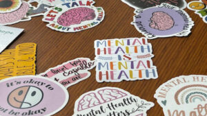 Mental health stickers laying on a table.