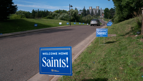 Welcome home Saints signs lining the entrance of St. Scholastica.