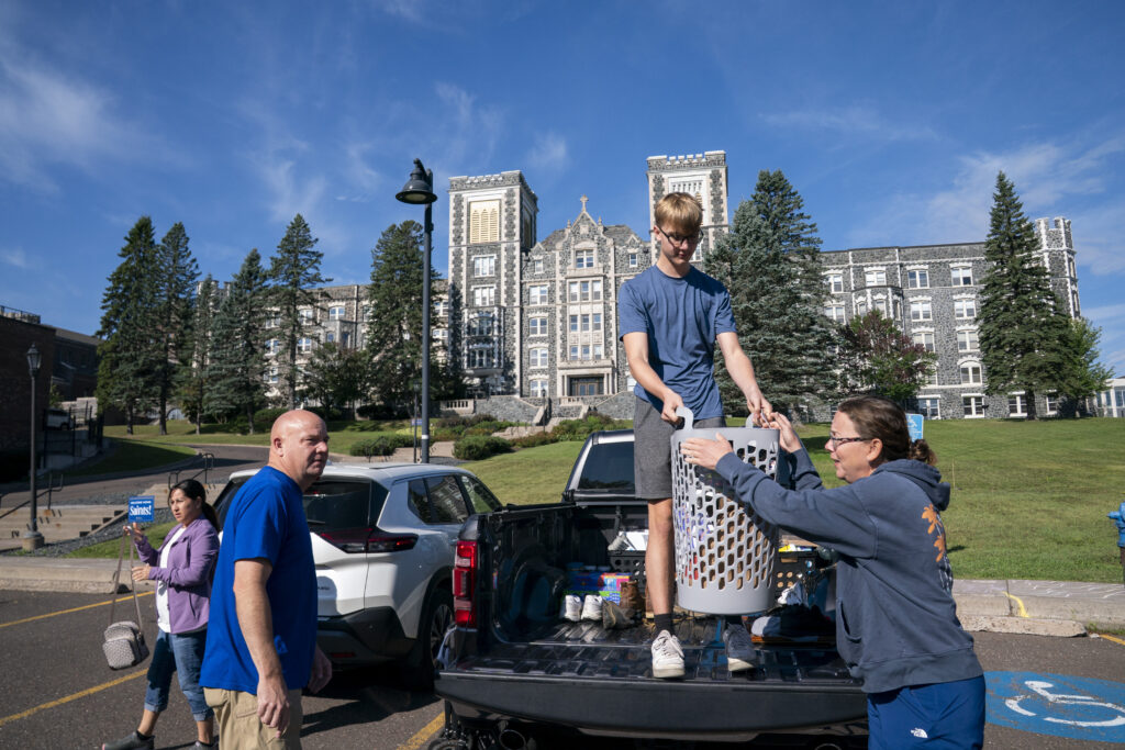 Families moving items into Somers Hall.