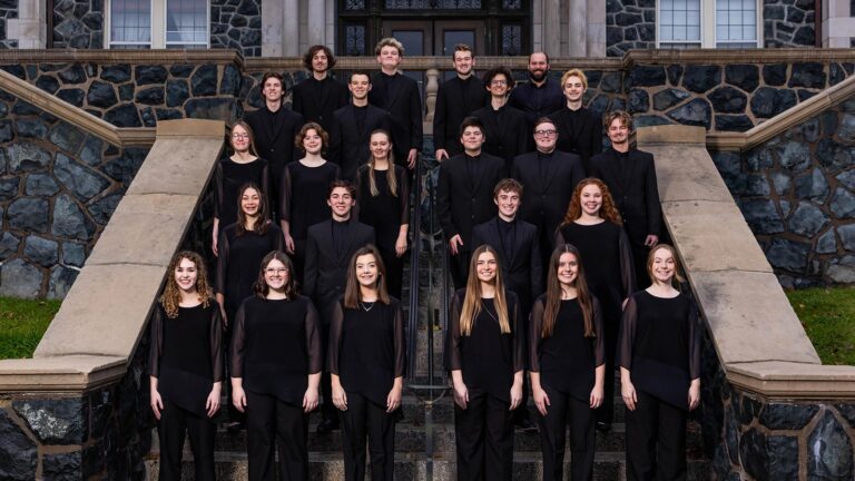 Group of choir students in the Mitchell Auditorium at St. Scholastica.