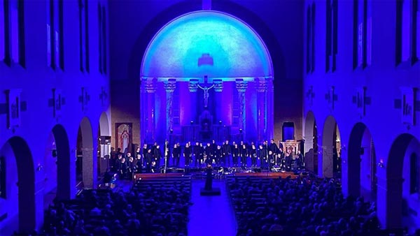 St. Scholastica choir performing at O Holy Night.