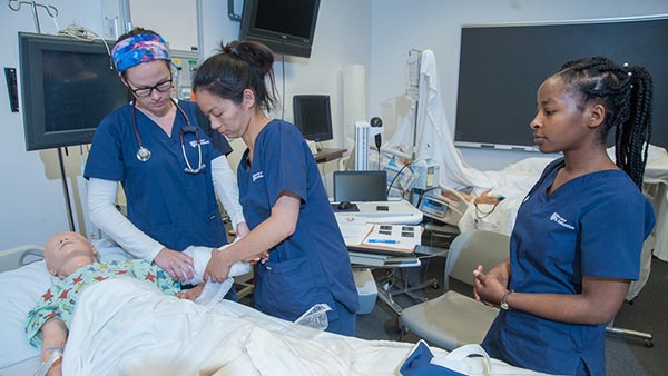 St. Scholastica students in the nursing simulation lab.