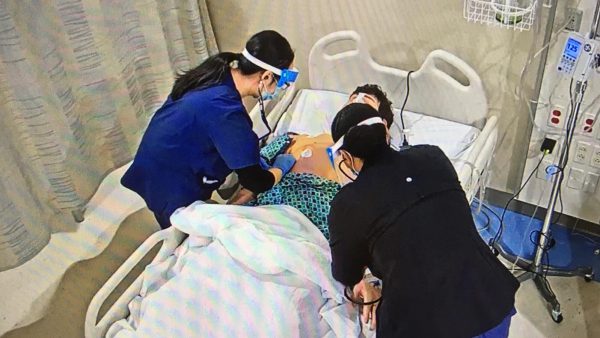 PBN students working on a patient in the nursing sim lab.
