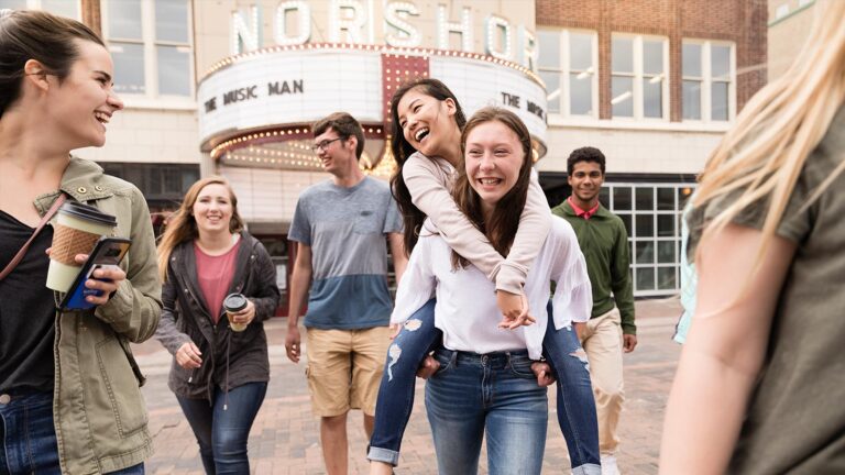 Photo of Students walking and chatting in downtown Duluth