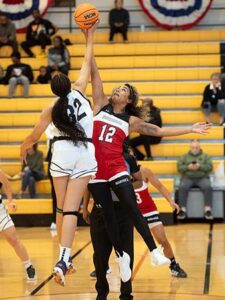 Photo of Briana Allen playing basketball.