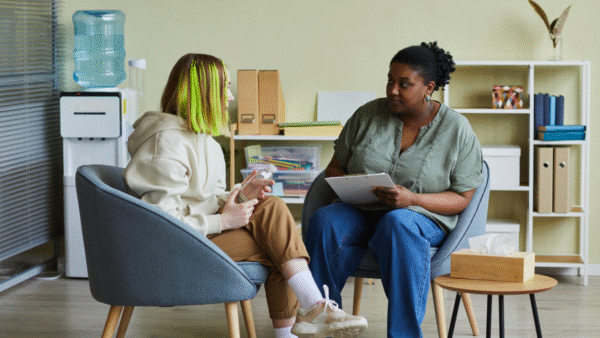 Social worker in a session with a teenage client.