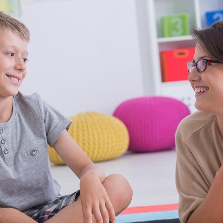 Teacher working with a student.