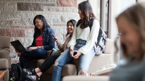 Photo of students laughing and studying together