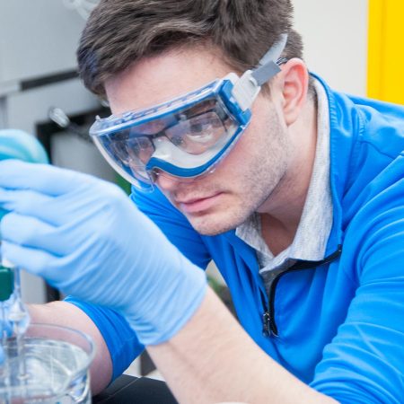 St. Scholastica natural sciences student working in a biology lab.
