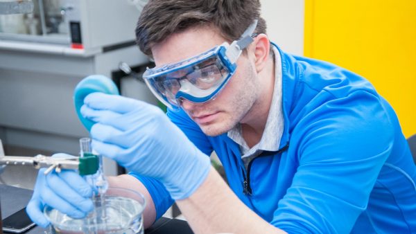 St. Scholastica natural sciences student working in a biology lab.