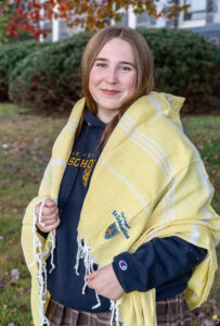 Student wears yellow branded Turkish Towel.