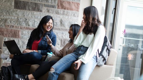 Students gathering in a student lounge at St. Scholastica.