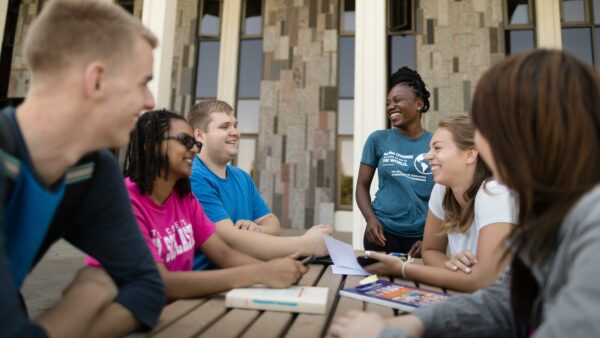 Students gathering in front of the Science Center on the St. Scholastica campus.