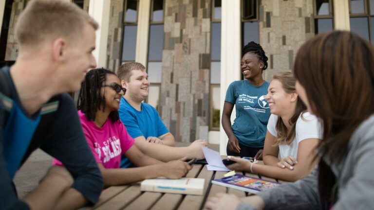 Students gathering in front of the Science Center on the St. Scholastica campus.