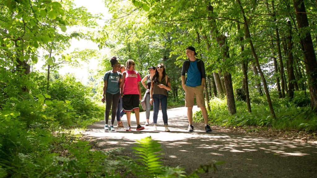 St. Scholastica students walking on the St. Scholastica Duluth campus trails.