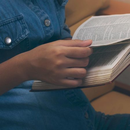 Person reading a Bible.