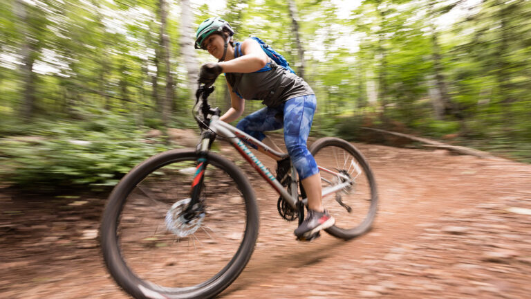 St. Scholastica student biking on a trail in the Duluth, MN area.