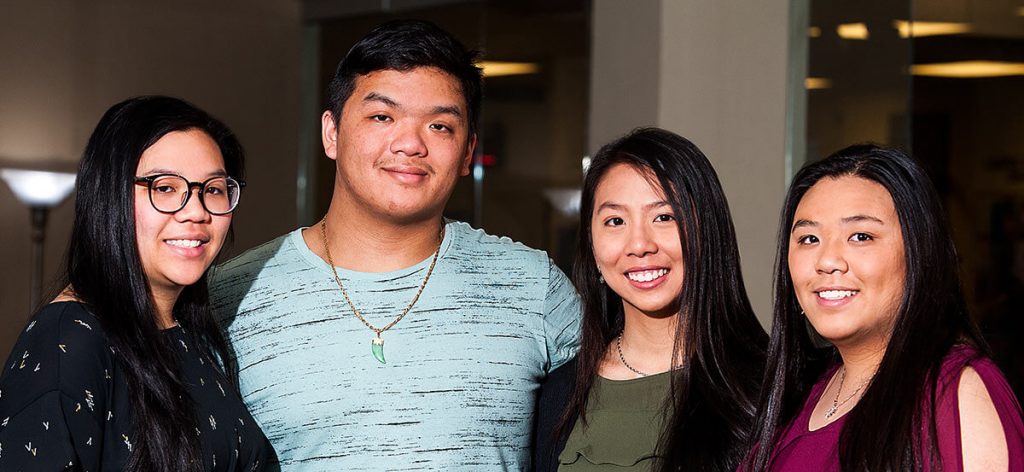 Elizabeth Tran, Michael Nguyen, Mary Tran and Julie Tran in the Intercultural Center at St. Scholastica