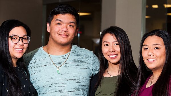 Elizabeth Tran, Michael Nguyen, Mary Tran and Julie Tran in the Intercultural Center at St. Scholastica