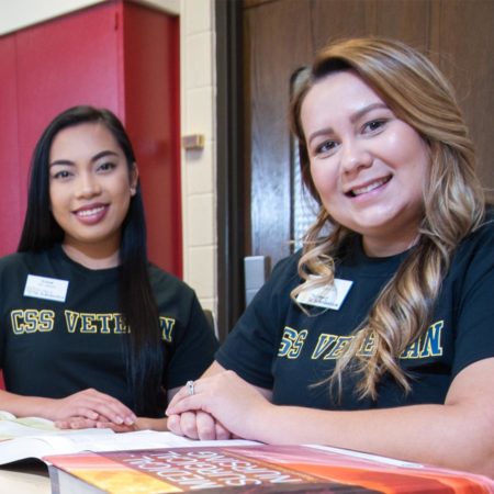 Two Veteran to BS in Nursing St. Scholastica students studying.