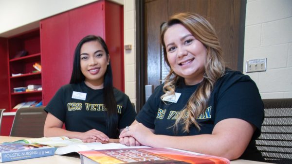 Two Veteran to BS in Nursing St. Scholastica students studying.