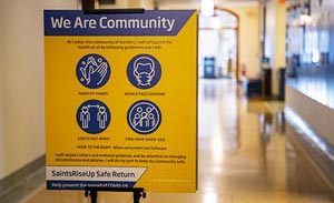 We Are community Sign in the hallway of Tower Hall.