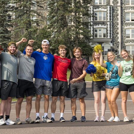 Photo of students in front of tower hall.