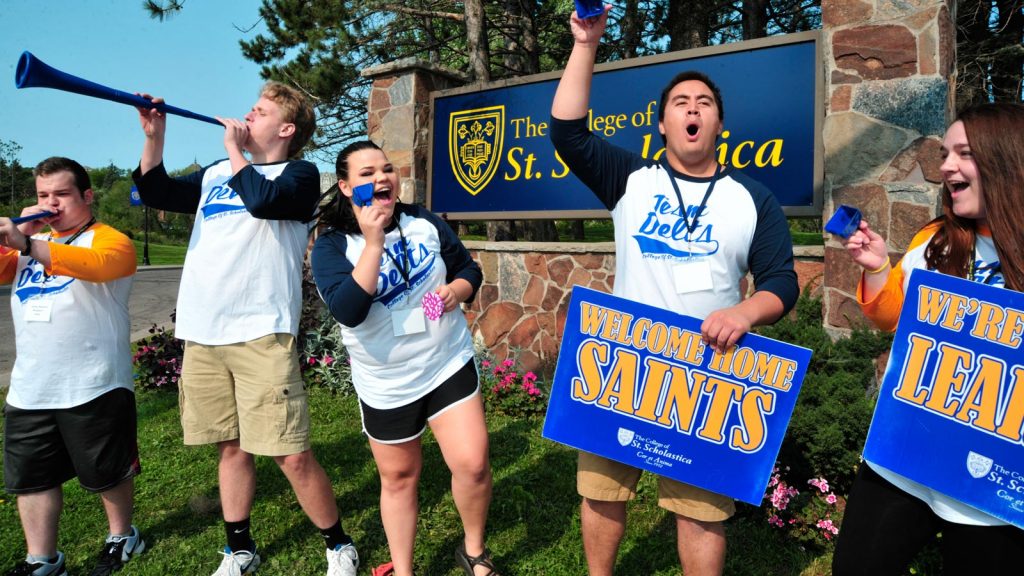 Delta team members welcoming new students.