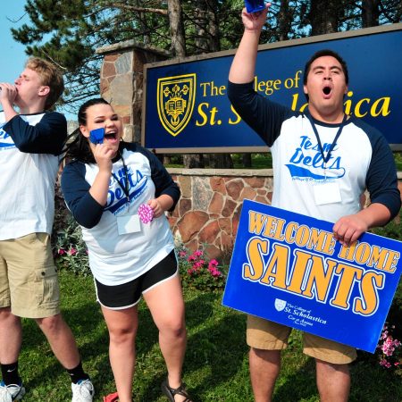 Delta team members welcoming new students.